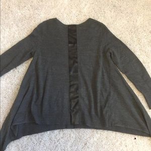 Grey asymmetrical sweater with leather strip